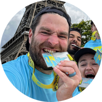 James Dunn at the Eiffel Tower biting his medal James Dunn at the Eiffel Tower biting his medal